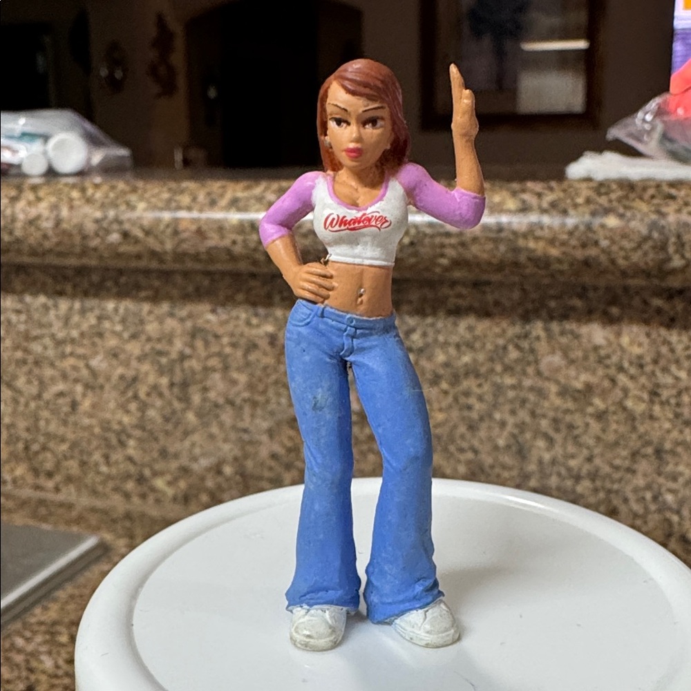 The figurine is "Big Booty Nancy" from the Lil' Locsters Series 3